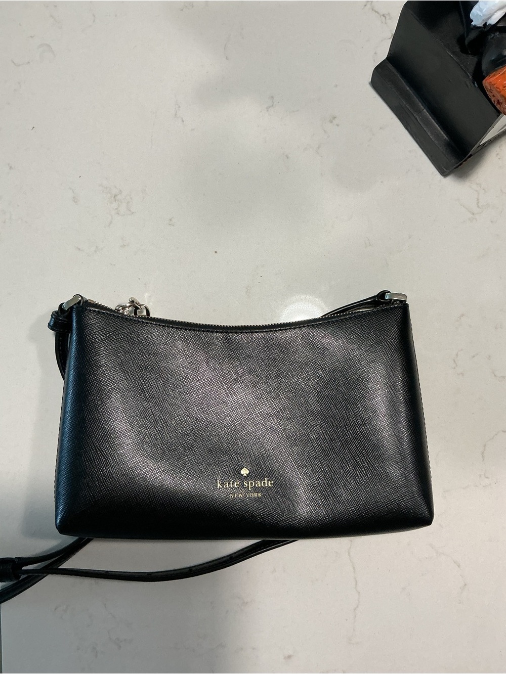 kate spade black leather crossbody with gold logo